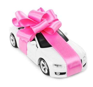 New Car With Pink Bow As Present Isolated On White