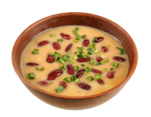 Bean soup in bowl isolated on white