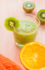 Healthy diet fruit juice kiwi orange wooden table