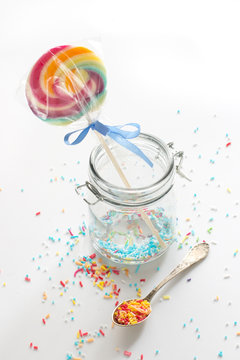 candy - colorful sugar sprinkles and a lollipop