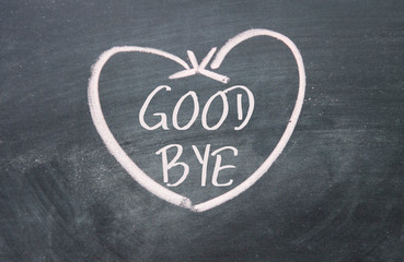 good bye text and heart sign on blackboard