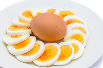 Sliced boiled egg arranged on a white plate