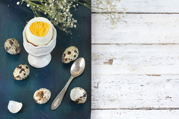 boiled egg on blue wooden background
