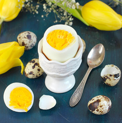 boiled egg on blue wooden background