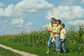 Fototapeta premium Family standing in field