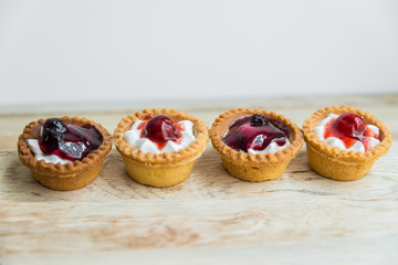 Strawberry and Blueberry tart on wooden floor