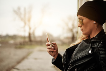 Young blonde girl with mobile phone