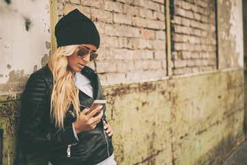 Young blonde girl with mobile phone