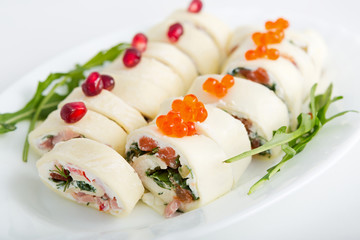 Cheese rolls with ham and red fish