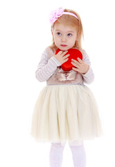 dreams of a little girl close to her heart-shaped box