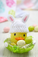 Easter decoration with little duck and eggs