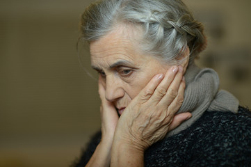 Sad aged woman