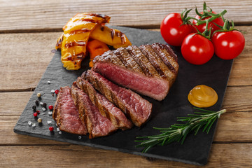 grilled beef steak rare sliced with vegetables