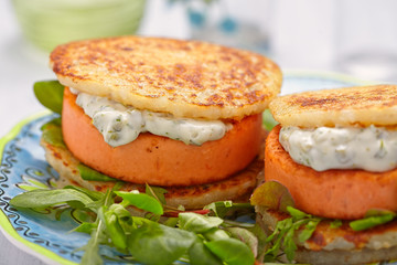 Salmon burger with potato pancakes