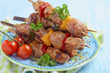 Grilled pork meat and vegetable kebabs