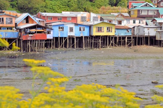 Houses raised on pillars over the water in Castro, Chiloe