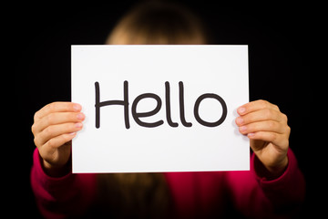 Child holding Hello sign