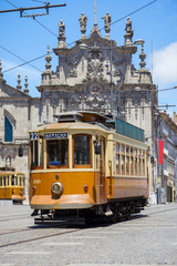 Fototapeta na wymiar Old tram in Porto street, Portugal