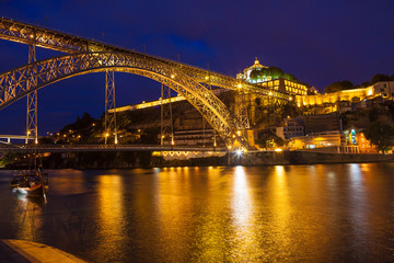 Fototapeta na wymiar Dom Luis I bridge over Douro river at night. Porto, Portugal