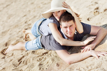 Fototapeta premium happy people are relaxing on a beach