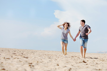 happy people are relaxing on a beach