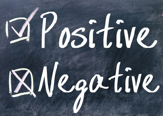 positive and negative choice sign on blackboard