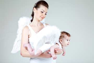 Beautiful woman with a baby angel