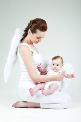 Beautiful woman with a baby angel