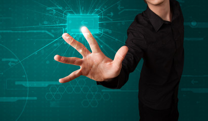 Fototapeta premium Businessman pressing high tech type of modern buttons