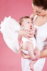 Beautiful woman with a baby angel