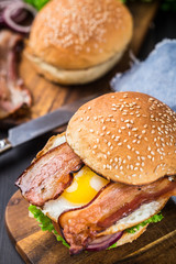 Home made burger on wooden board