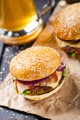 Delicious burger on wooden board