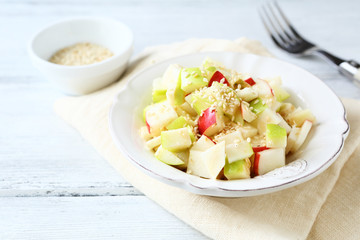 Tasty salad with apples and celery