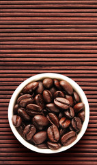 Coffee beans on bamboo floor