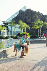 man hugging his girlfriend in the summer, smiling