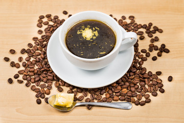 Obraz na płótnie Canvas Black coffee with added butter