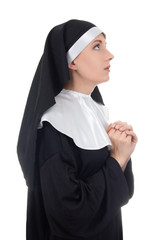 religion concept - young beautiful woman nun praying isolated on