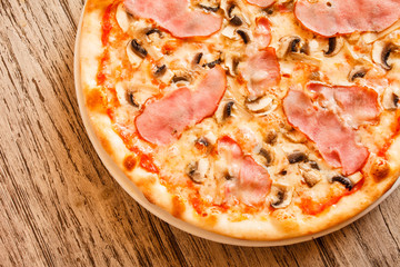 pizza on wooden background