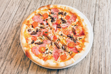 pizza on wooden background