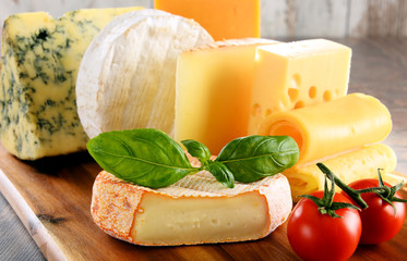 Different sorts of cheese on kitchen table