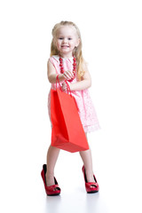 little girl in mother shoes on a white background