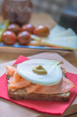 Healthy sandwich salmon onion mustard on whole grain bread
