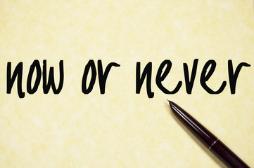 now or never text write on paper