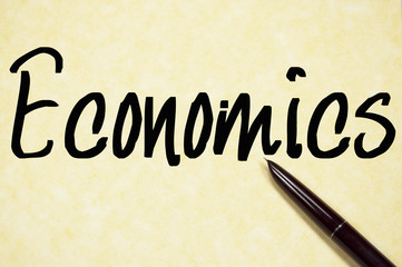 economics word write on paper