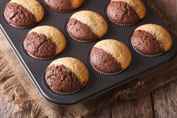 two-color muffins in baking dish closeup. Horizontal