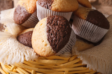 chocolate orange muffins in a basket close-up, horizontal