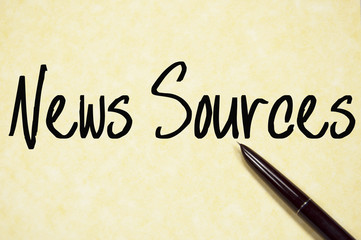 news sources text write on paper