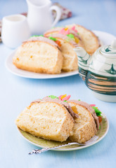 Slices of sponge cake with buttercream on plate