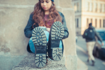 Beautiful girl posing in an urban context