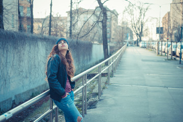 Beautiful girl posing in an urban context
